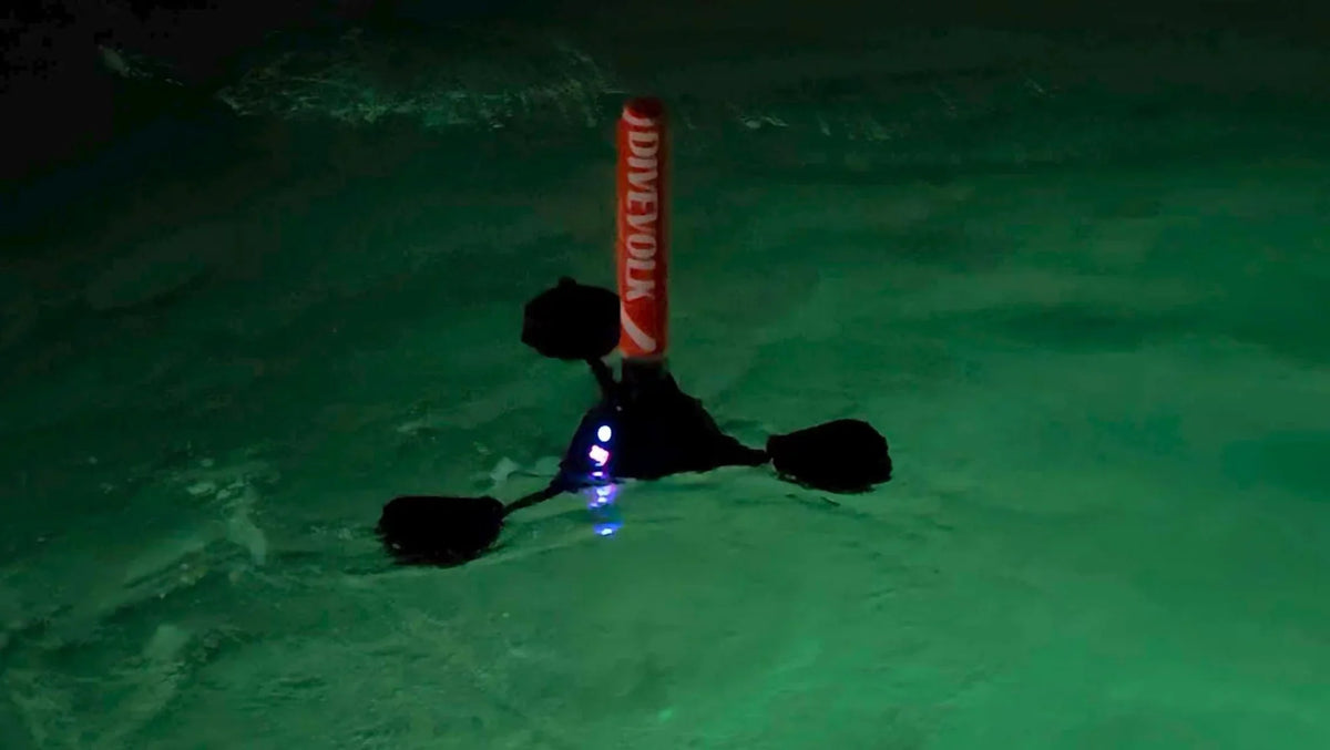 DIVEVOLK SeaLink surface unit floating above the DiveForLove night dive team in Da'ao Bay, carrying picture and voice to shore