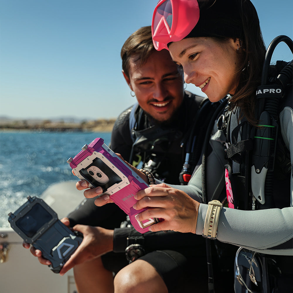 Divers with DiveVolk SeaTouch 4 Max underwater phone housings.