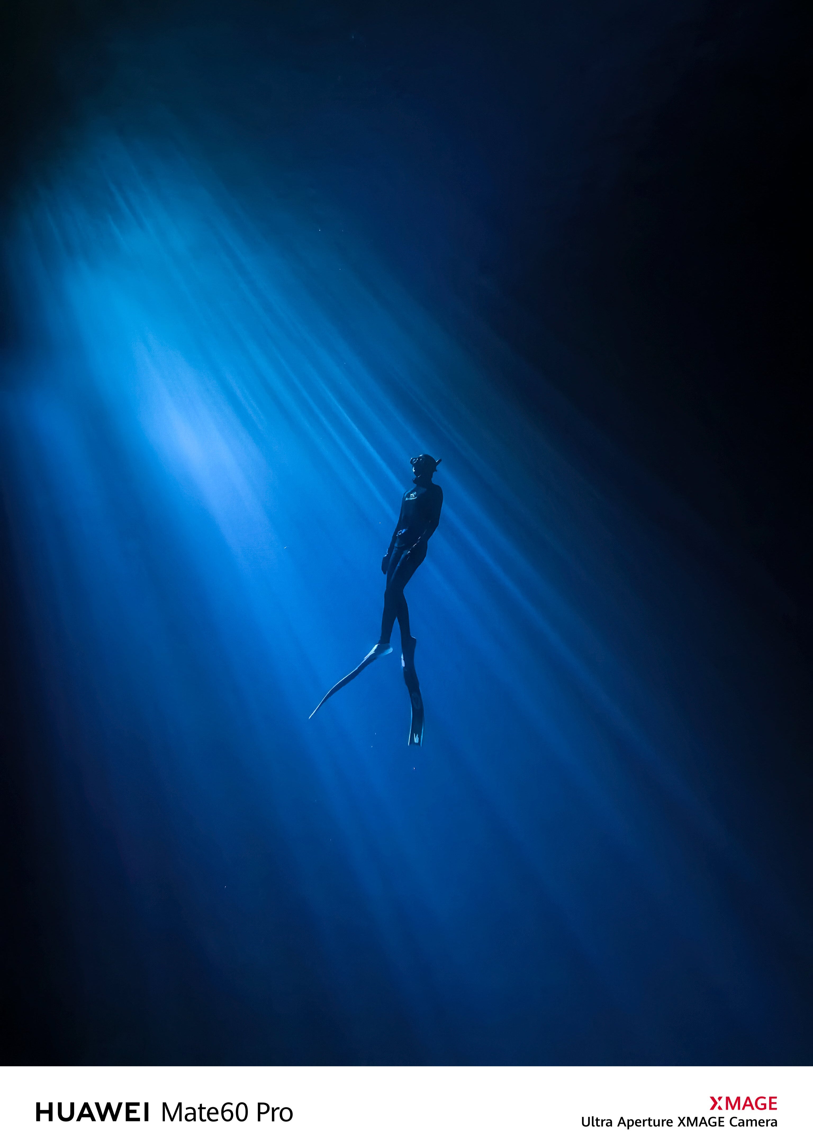 A diver captured in silhouette against a blue light beam underwater, shot with the SeaTouch 4 Max Plus Housing, showcasing the dramatic and mysterious atmosphere of underwater photography.