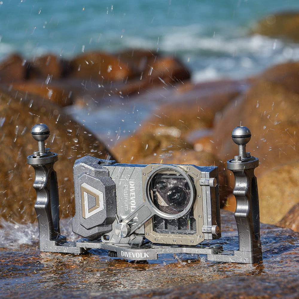 DiveVolk dual handle tray with SeaTouch housing on rocks.