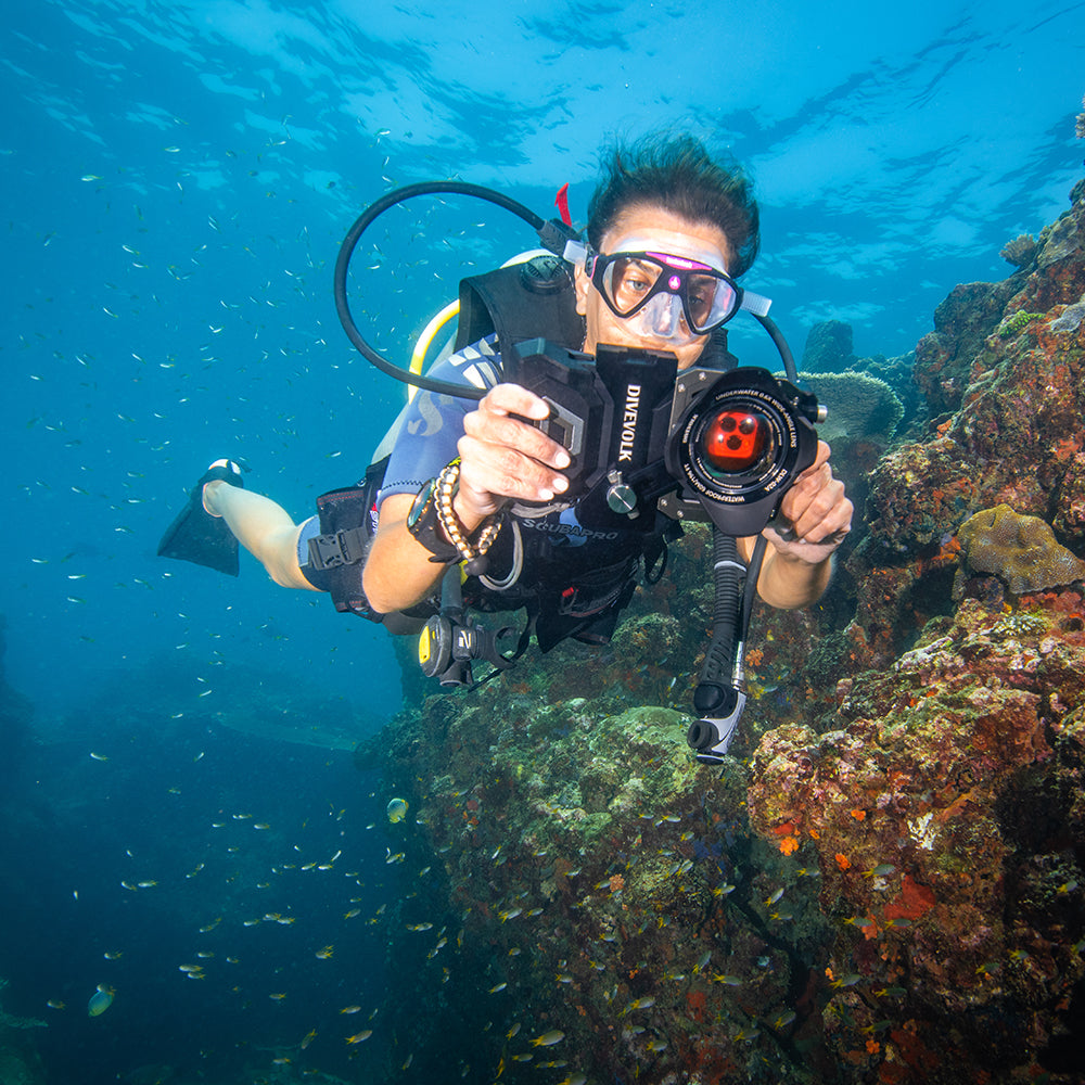 Diver using DiveVolk housing with underwater color filters.