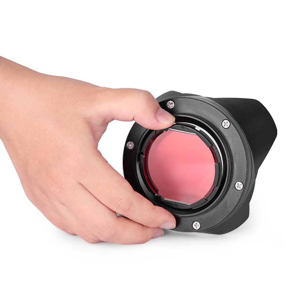Hand inserting DIVEVOLK Internal Red Filter into expansion clamp mount — quick snap-in installation with zero added thickness.