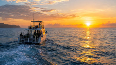 Dive boat heading out to sea at sunrise