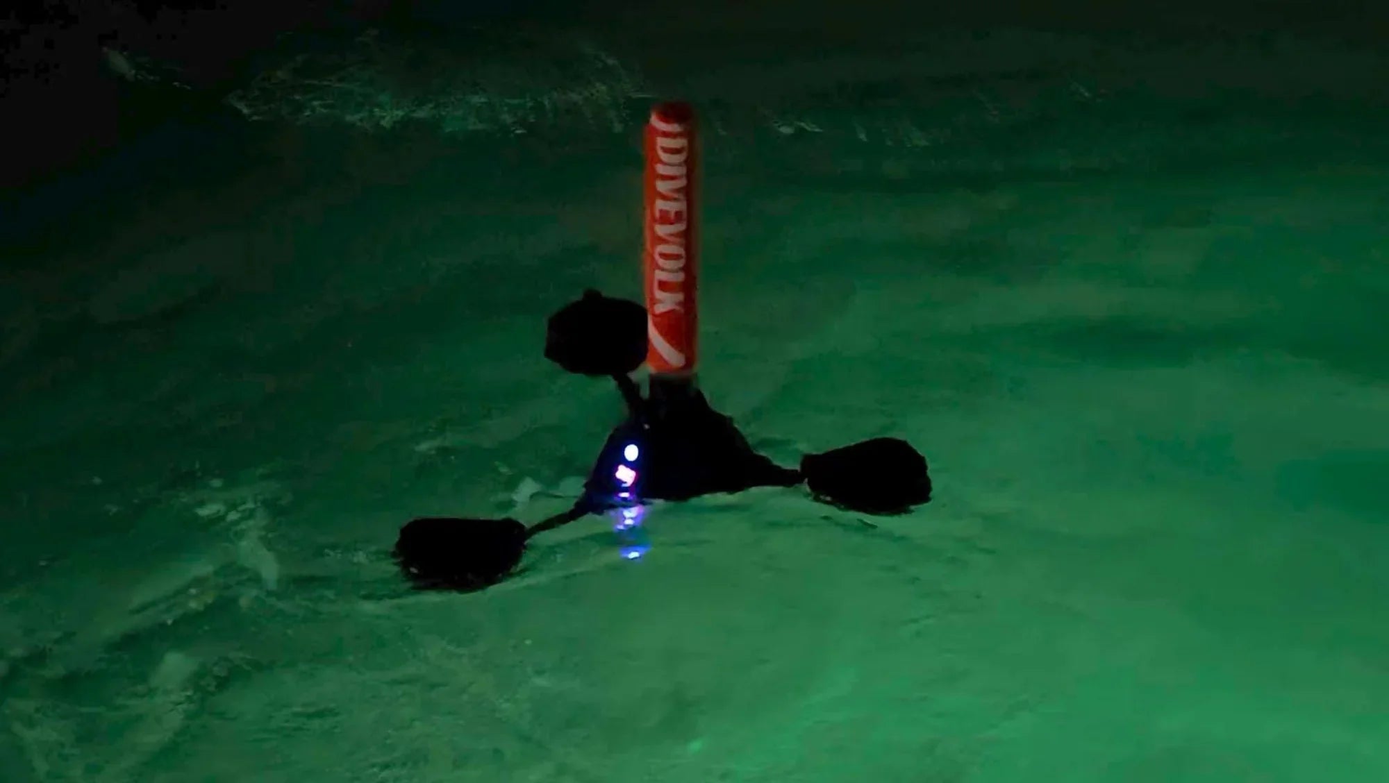 DIVEVOLK SeaLink surface unit floating above the DiveForLove night dive team in Da'ao Bay, carrying picture and voice to shore