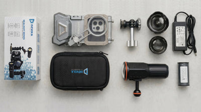underwater photography travel kit flatlay hero