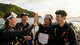 young divers celebrating graduation on boat