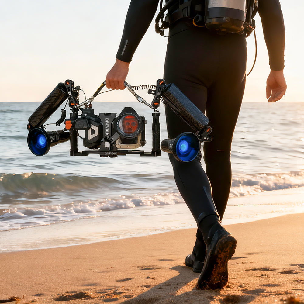 Scuba diver carrying the SeaTouch 4 Max Plus Almight SL120 Kit for diving underwater camera