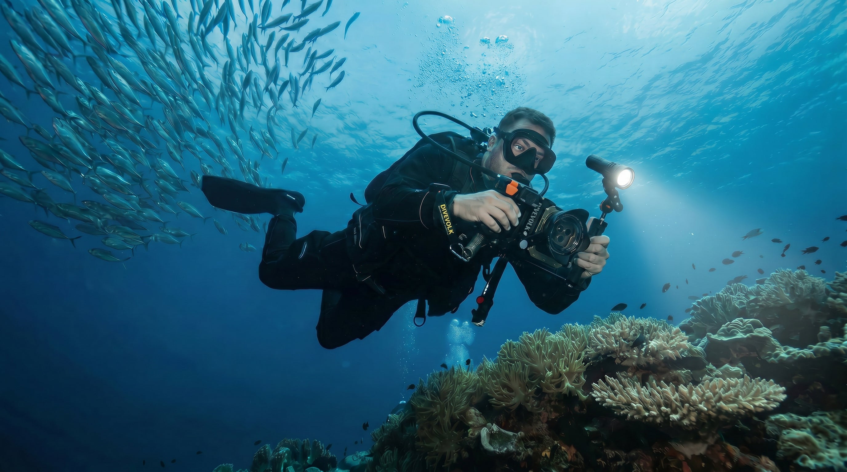 Diver using DiveVolk SeaTouch 4 MAX Underwater Housing Kit.