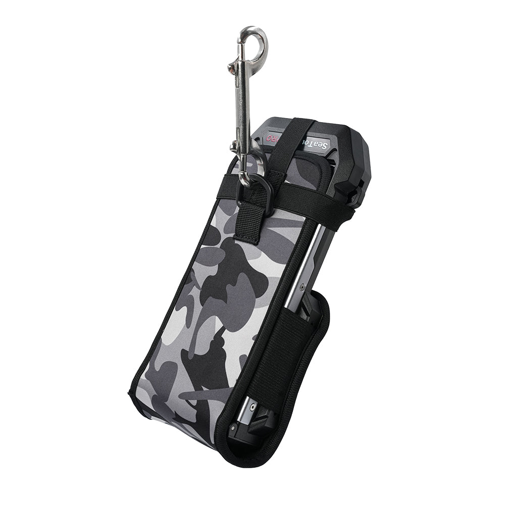 SeaTouch 6 PRO housing in camouflage protective cover with bolt snap carabiner — hanging ready for dive transport.