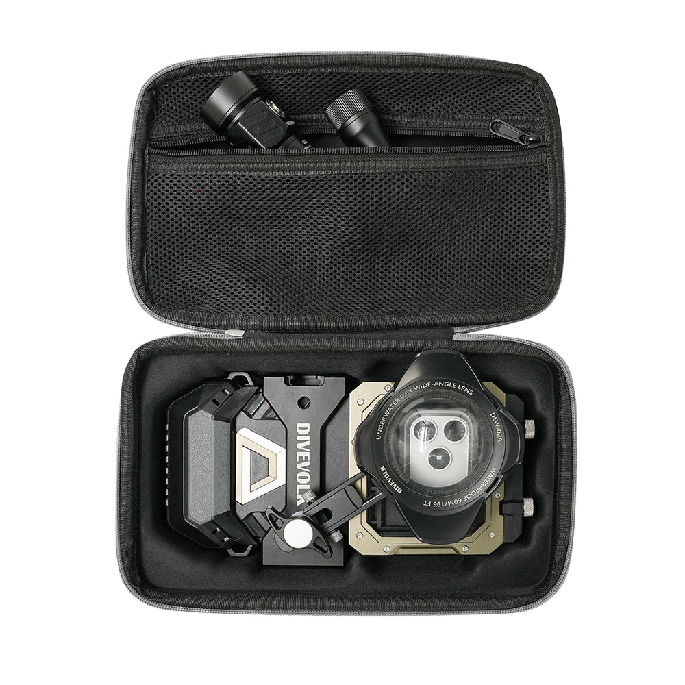 DIVEVOLK travel case top-down view — molded lower compartment holding SeaTouch 6 PRO housing with wide-angle lens kit, upper mesh pocket storing dive video light and accessories.
